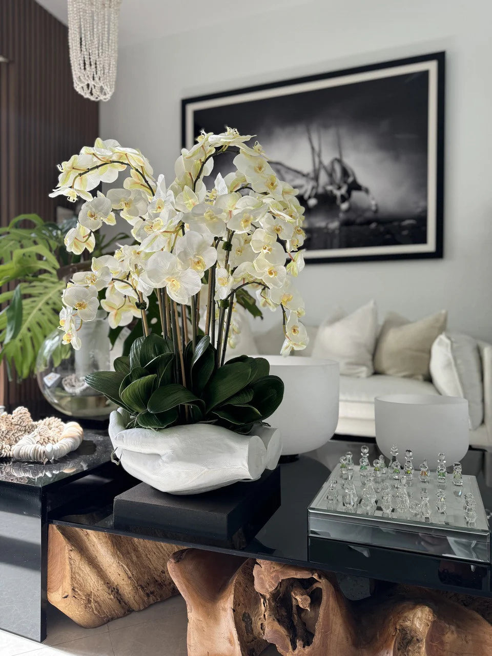 White Phalaenopsis Orchids in White Open Hands Sculpture Vase