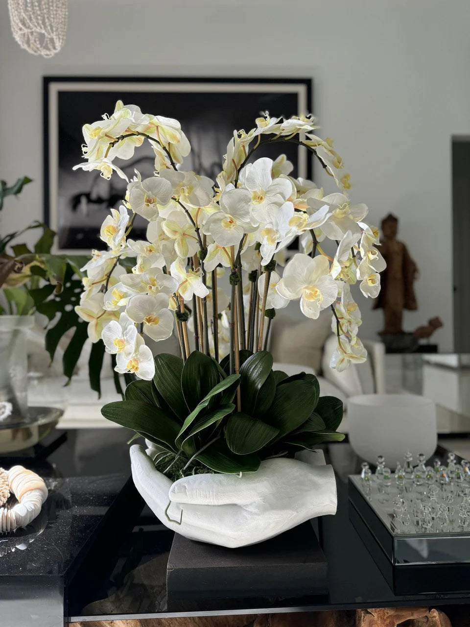 White Phalaenopsis Orchids in White Open Hands Sculpture Vase